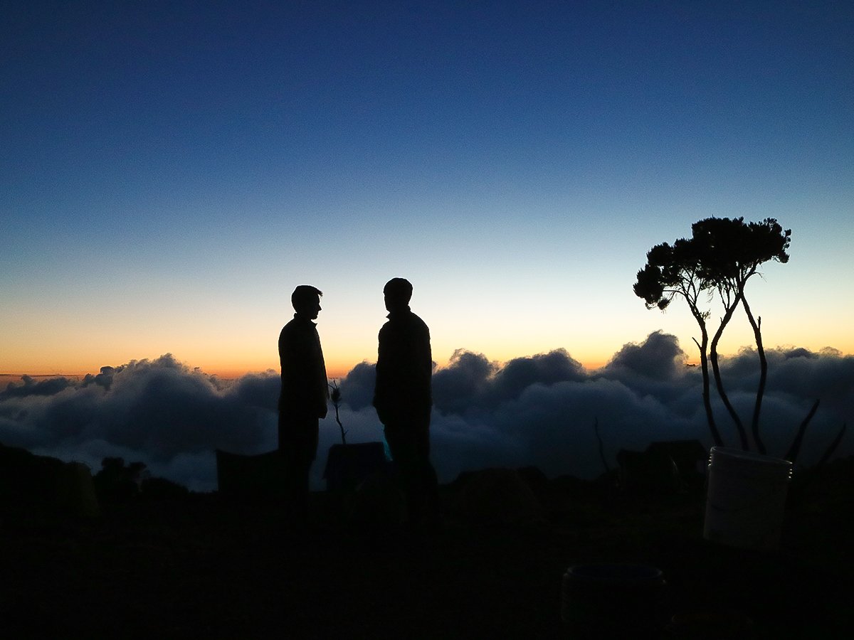 Two hikers on guided Mount Meru trek in Tanzania