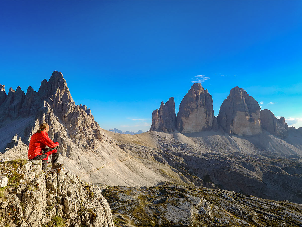 Hiker enjoying the views on Dolomites Haute Route Trek in Italy