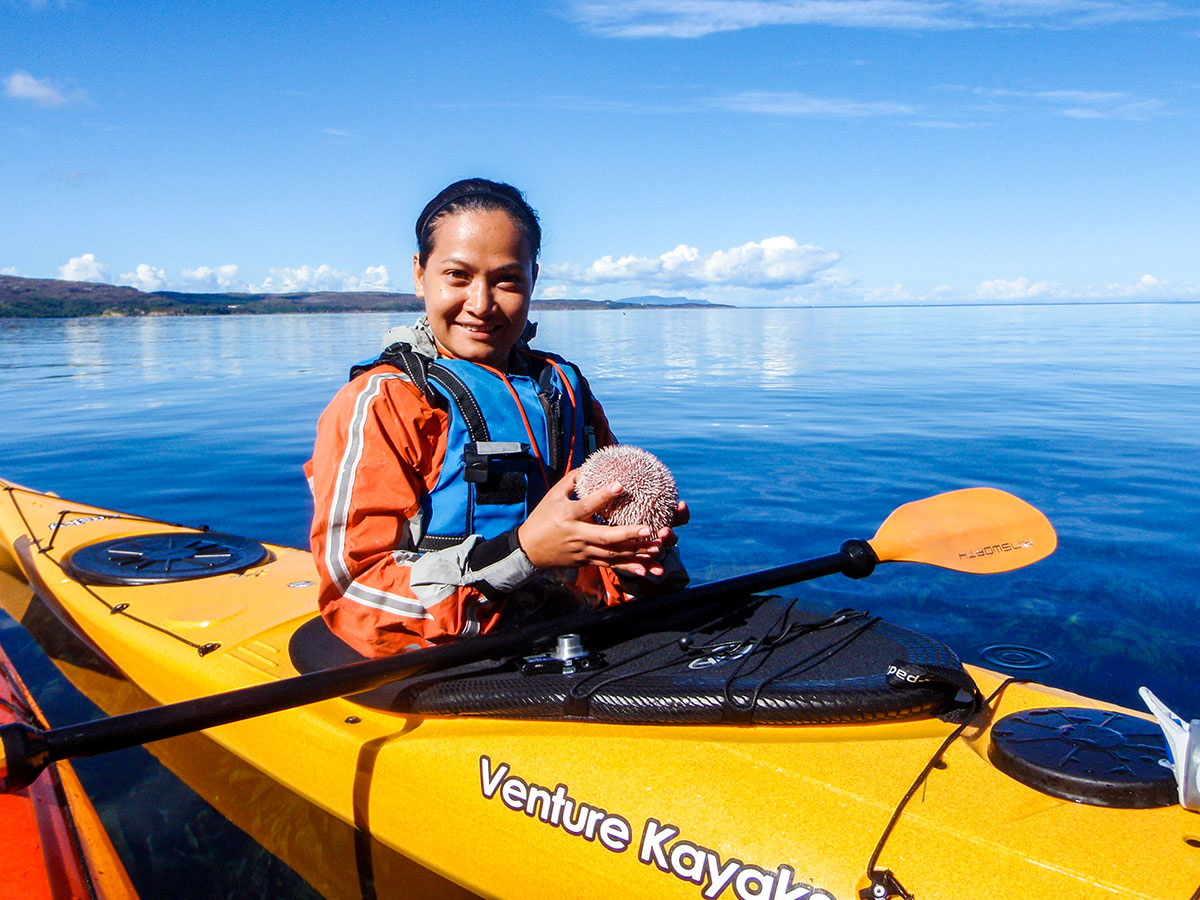 Happy kayaker posing on Sea Kayaking in Scottish Highlands Tour