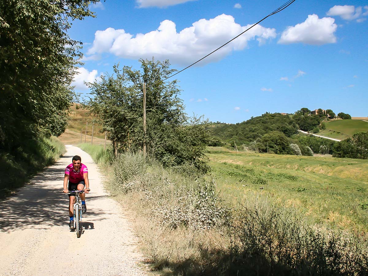 Biker cycling between Pisa and Florence in Italy