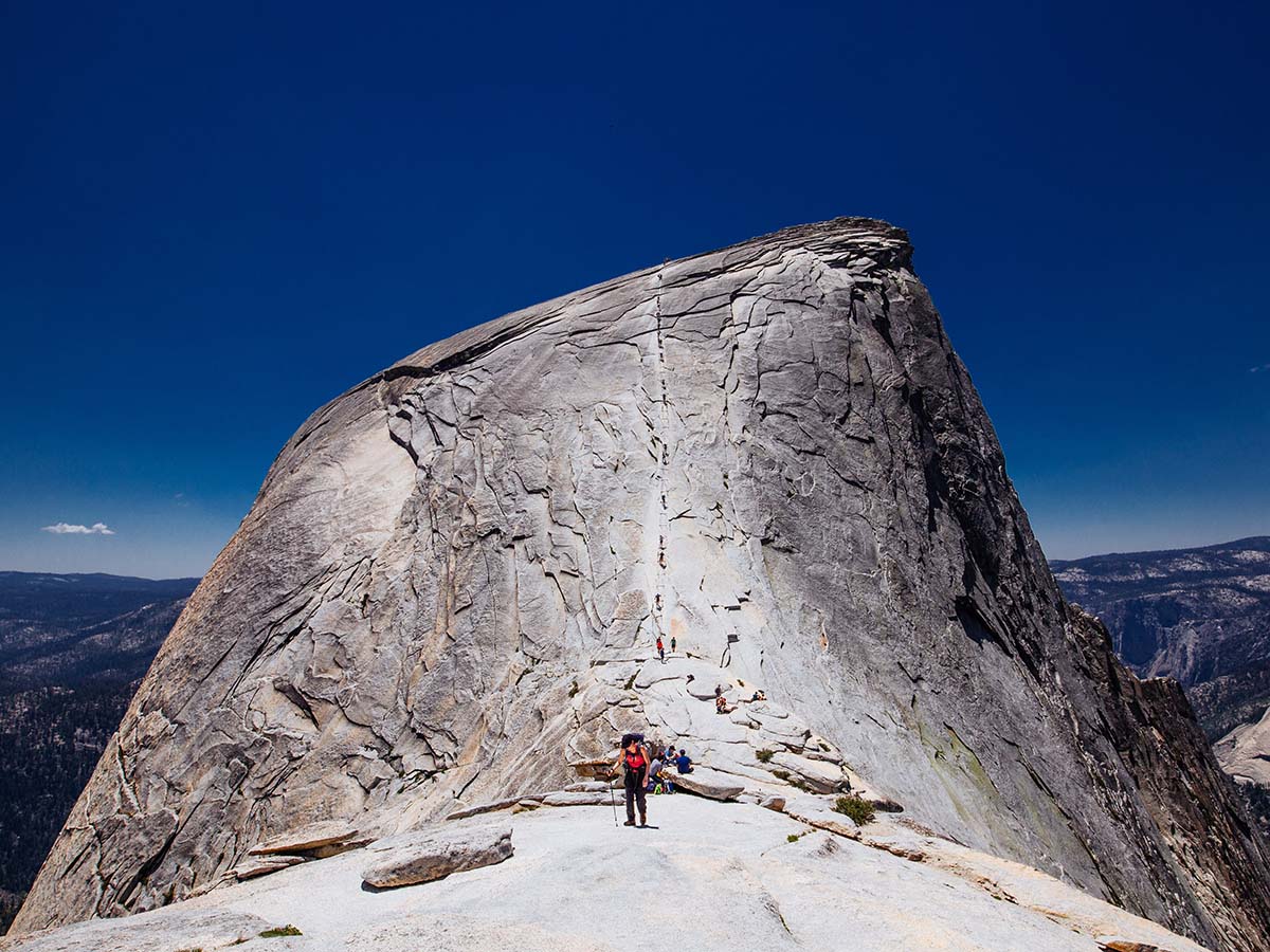 Hiker posing in front of the Half Dome