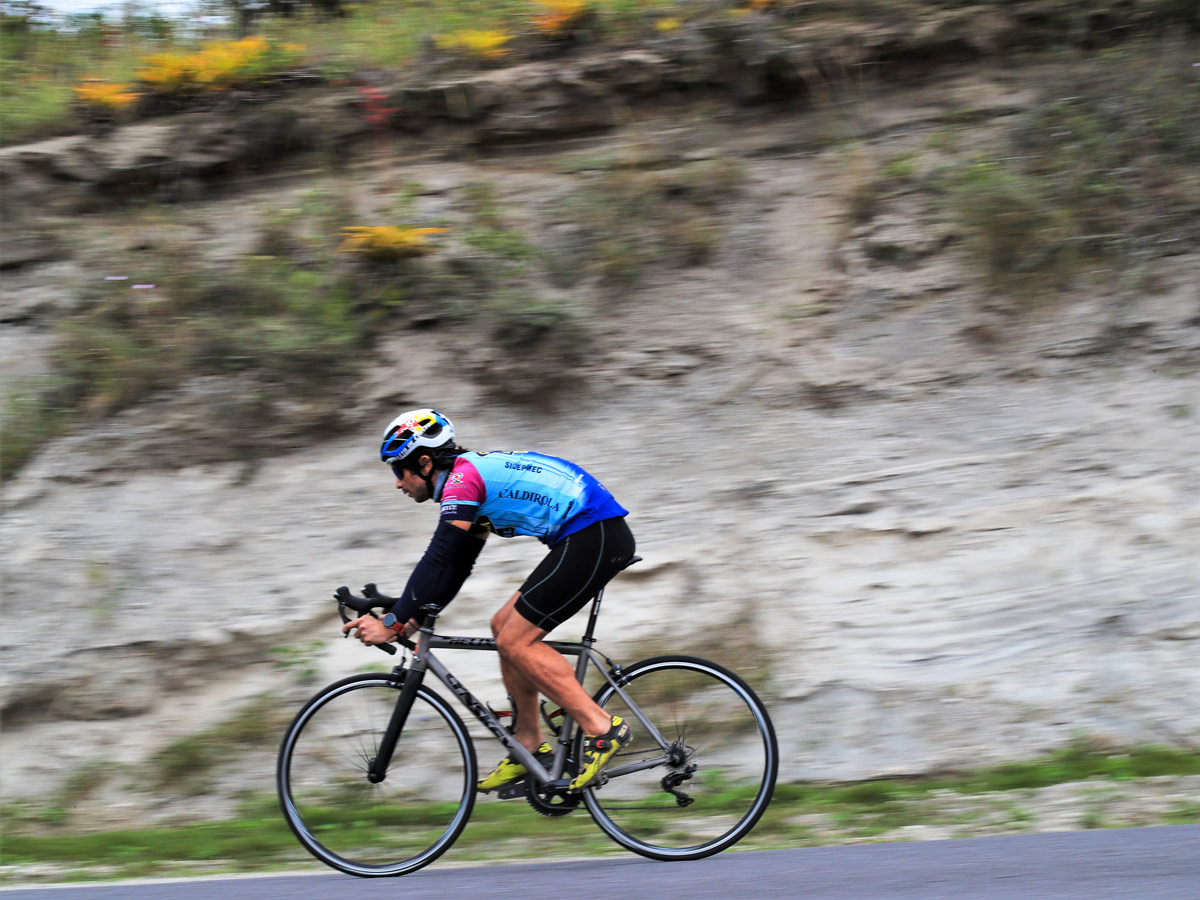 Cyclist biking mountain roads