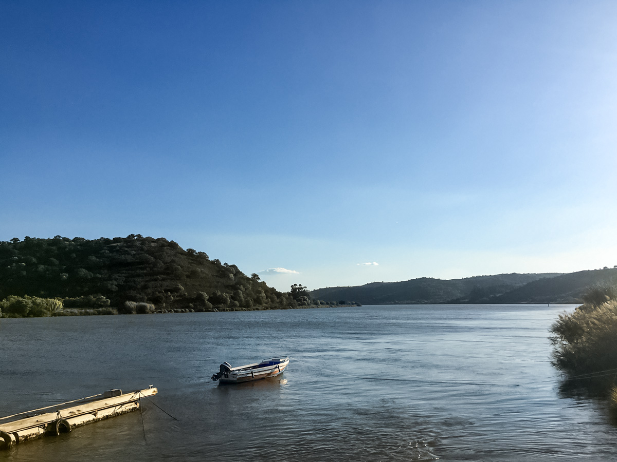 Road biking in Portugal adventure tour lake boat dock