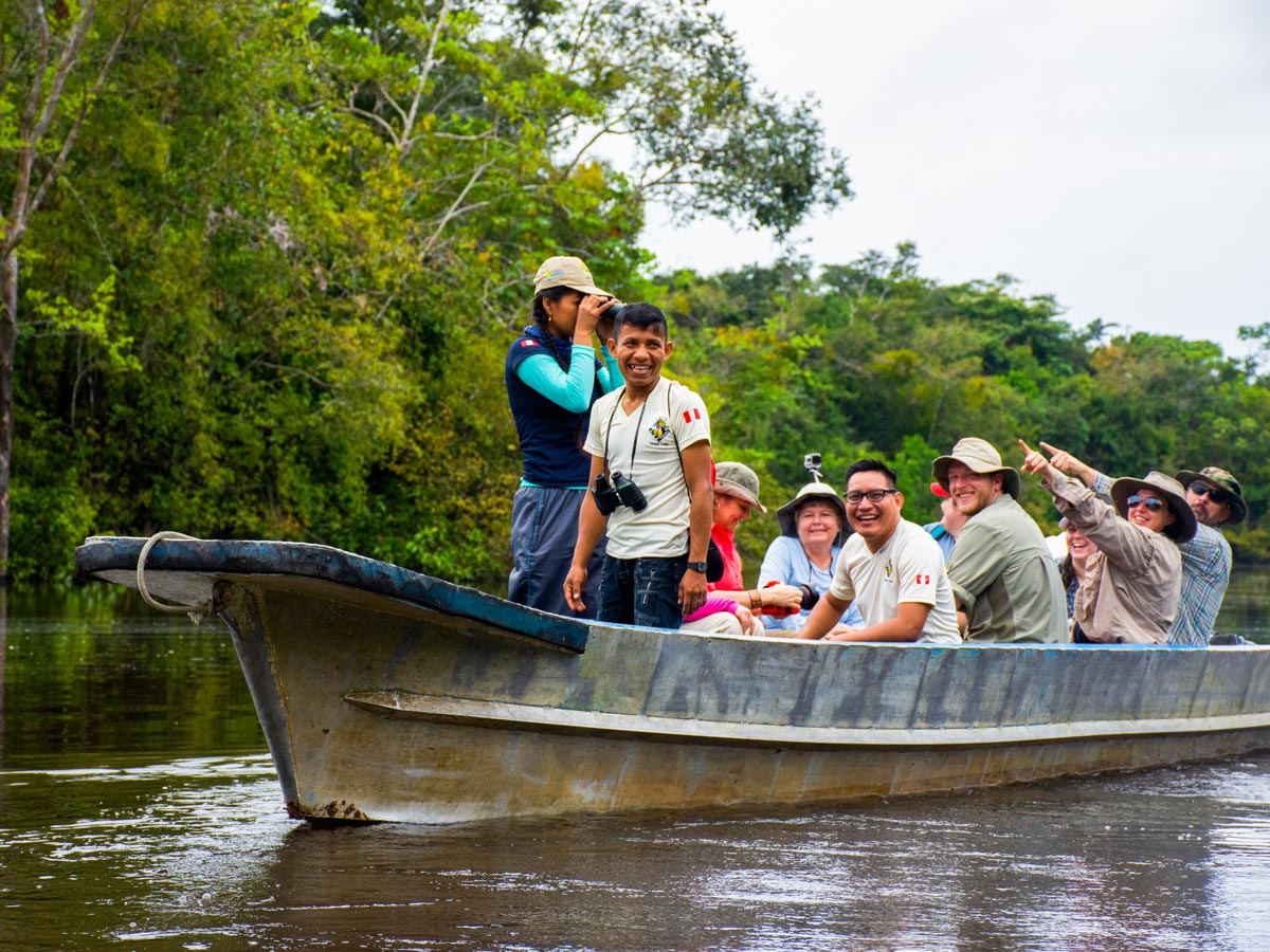 Boat tour birding expedition in the Amazon rainforest jungle Peru