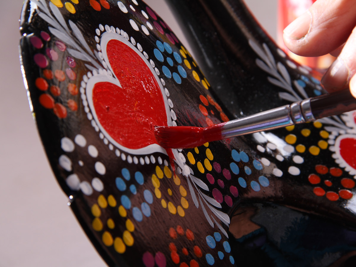 Hand painted heart artwork along family bike tour Minho Portugal