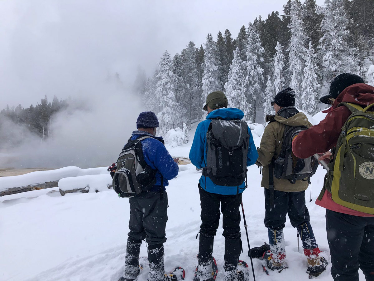 Yellowstone snow Solitary Geyser snowshoe adventure tour Yellowstone National Park USA