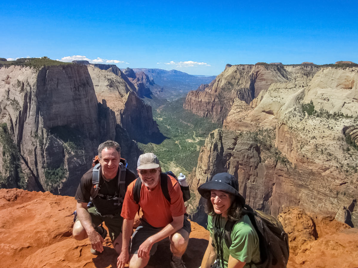 Happy hikers standing above gorge Bryce Canyon Zion National Park USA