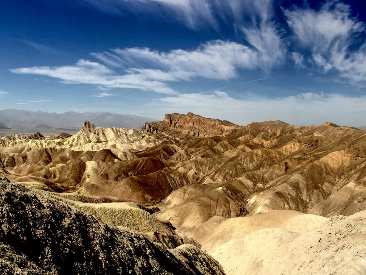 Beautiful rock formations desert sky Death Valley Utah road biking tour USA