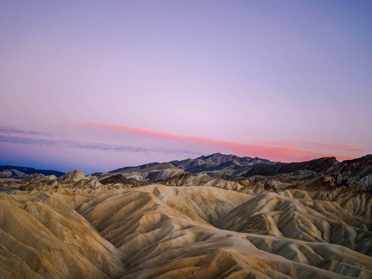 Sunset candy sky over Death Valley National Park road biking tour