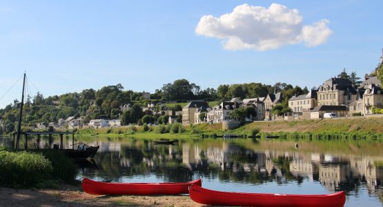 Two red boats near the river in France