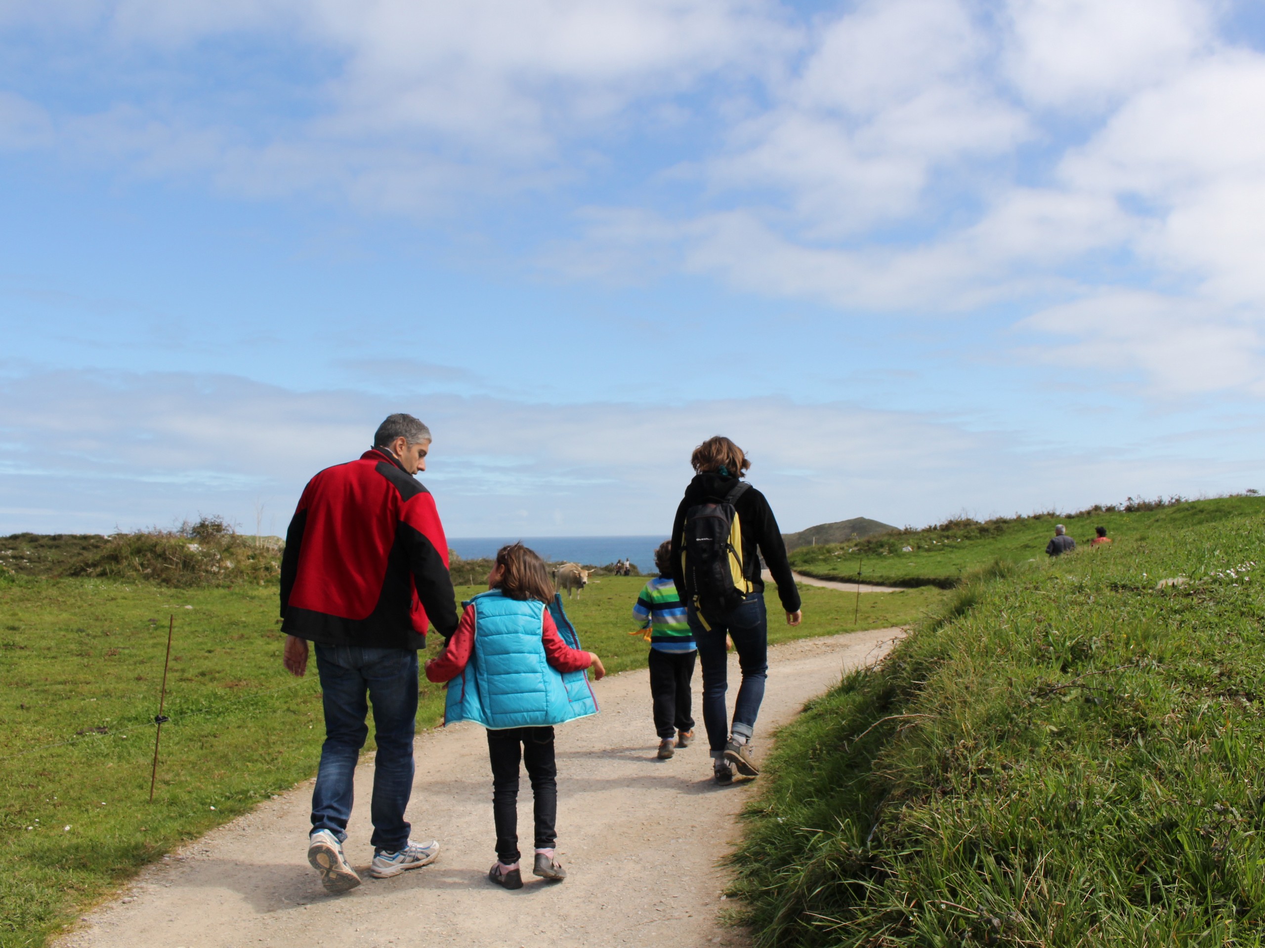 Family walking the coastal path in Portugal