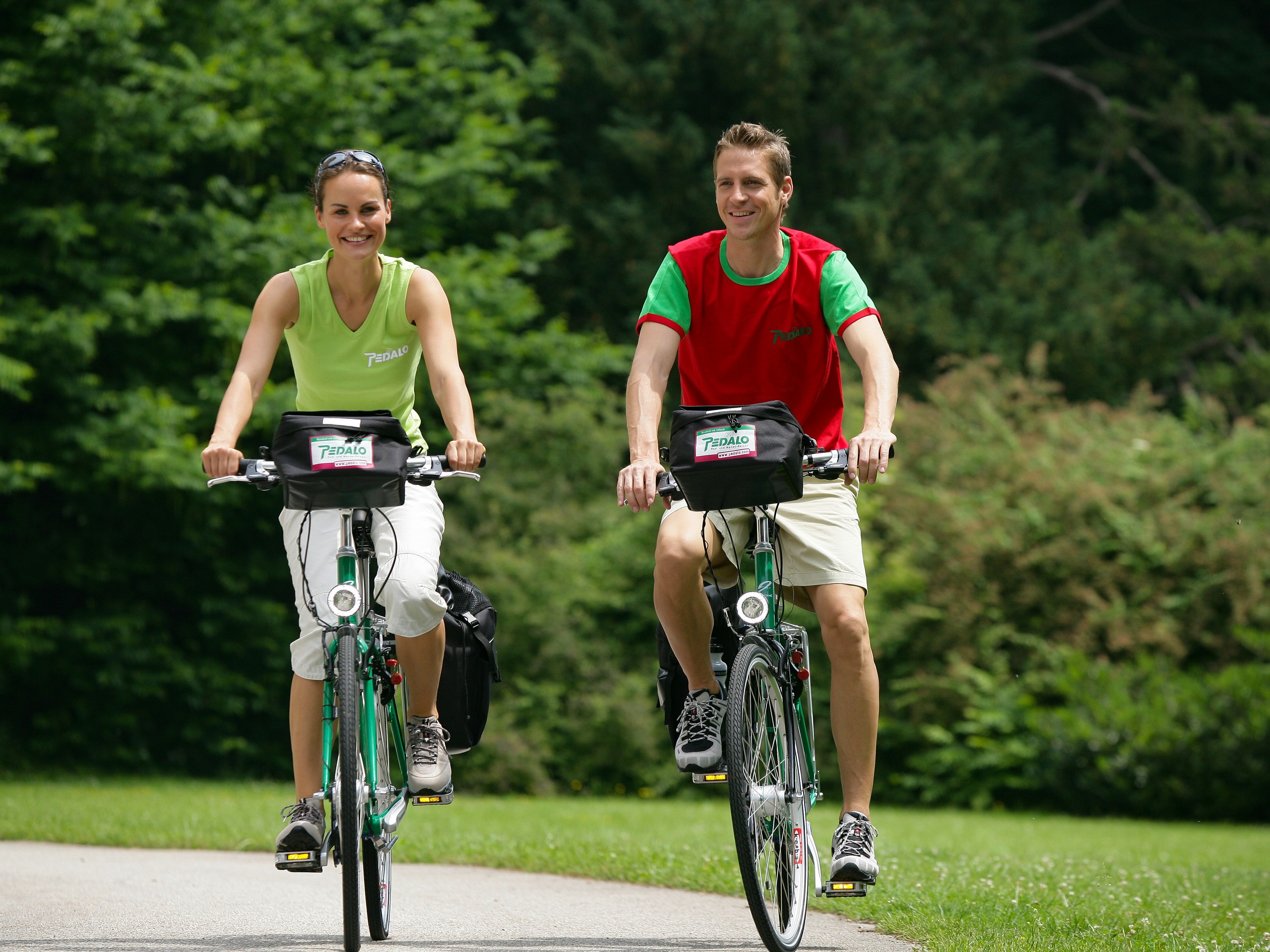 Two cyclists biking on the Drau Path in Germany