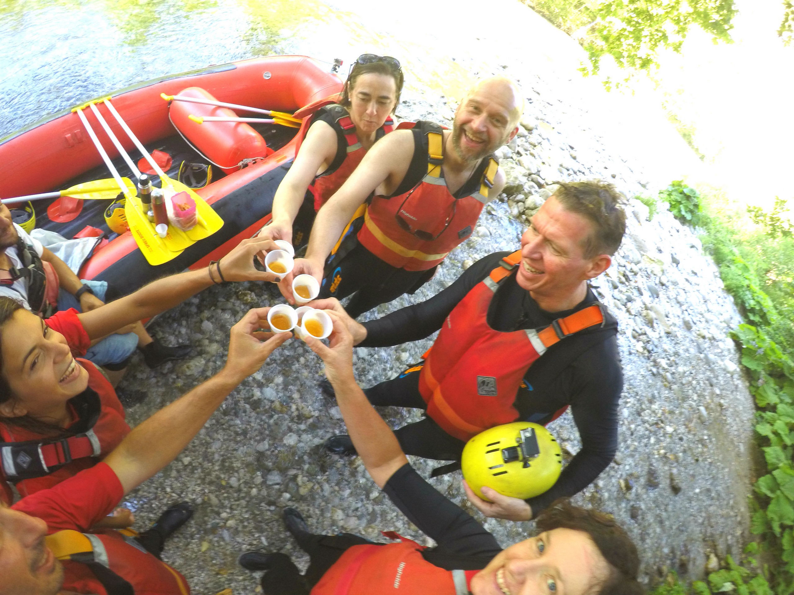 Group of rafters sharing drinks