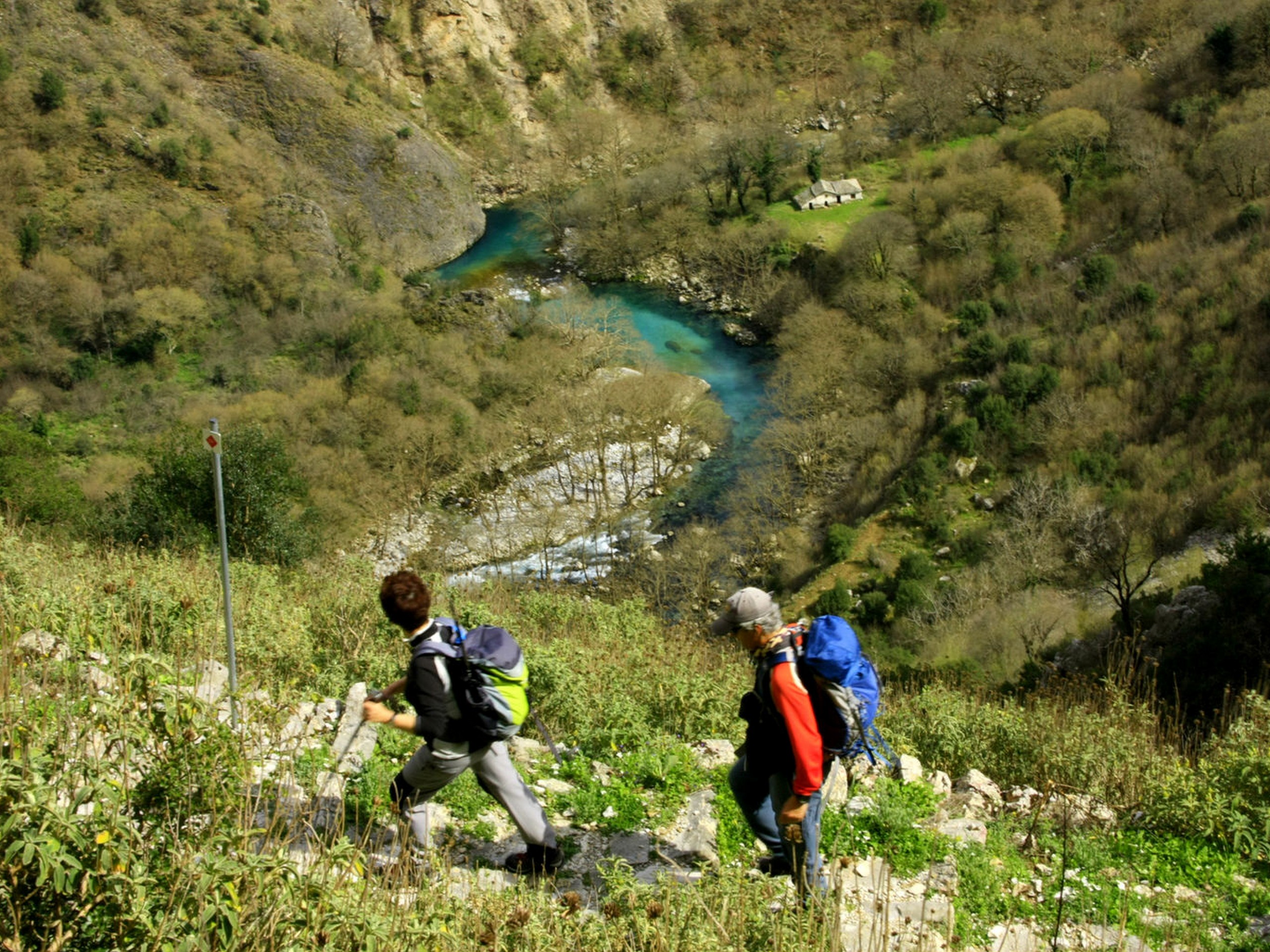 Two hikers walking in Greece mountains