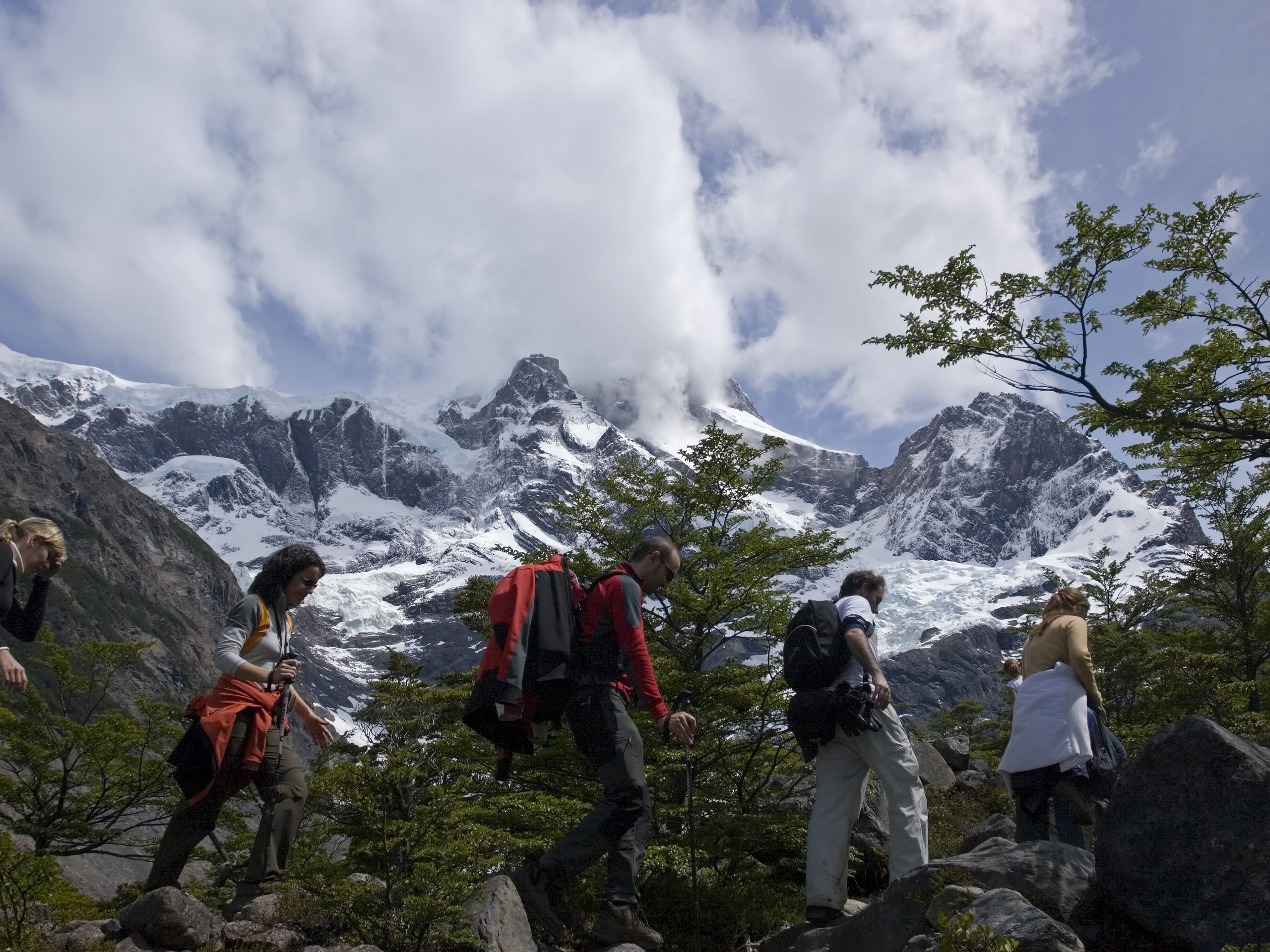 Group of hikers treeking in front of mountains of Patagonia