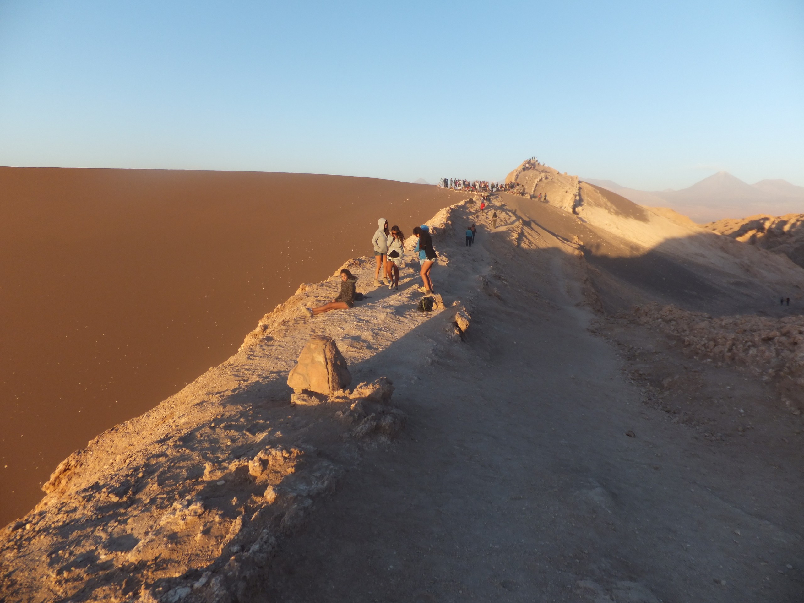 Walking on the sand dunes of Atacama Desert