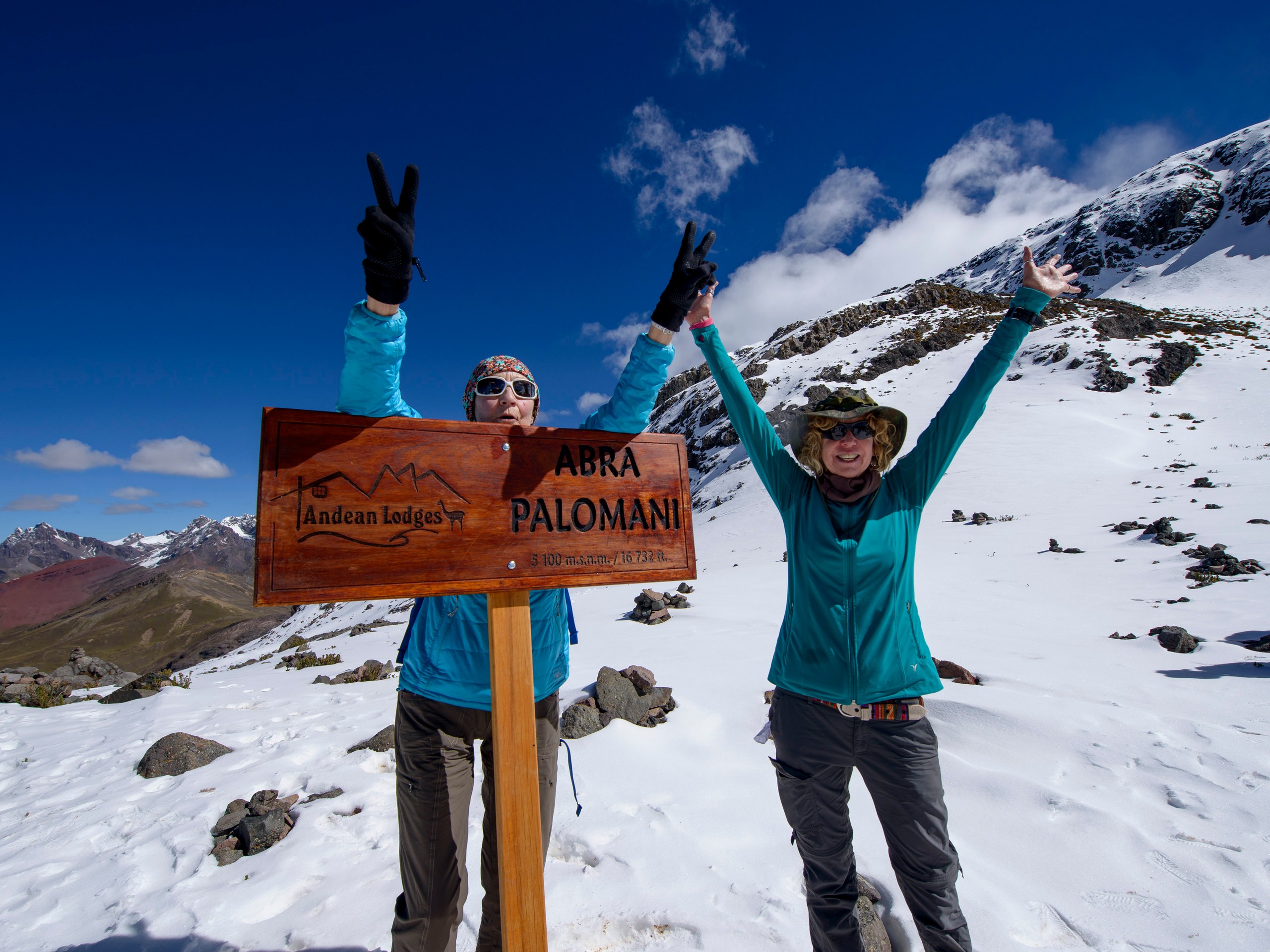 Couple celebrating climbing to the Highest pass of the trek - Palomani