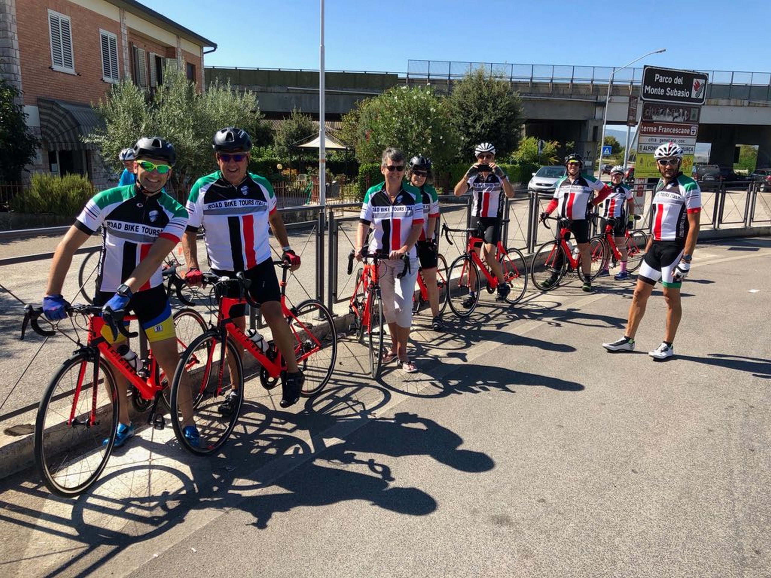 Group of cyclists biking in Italy